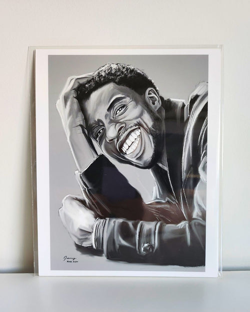 Chadwick Boseman portrait print by Full Art Alchemist, sleeved and standing upright against white wall