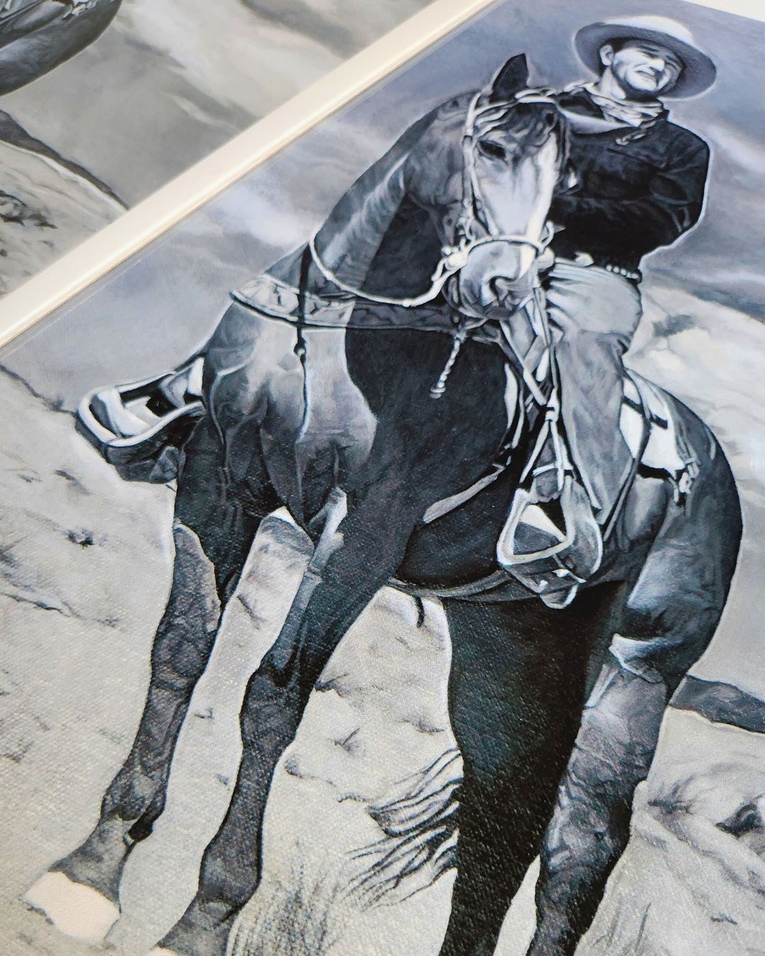 Close-up of horseback cowboy print by Full Art Alchemist — brush texture and canvas detail visible