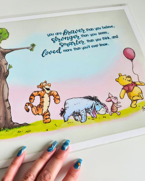 Angled view of the "Core Memory" print featuring Winnie the Pooh, Piglet, Eeyore, and Tigger, photographed in soft daylight for Full Art Alchemist.